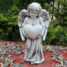Ezekiel Angel Holding Heart Fibrestone Garden Statue