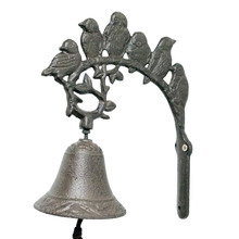 Birds Perched Over Iron Doorbell