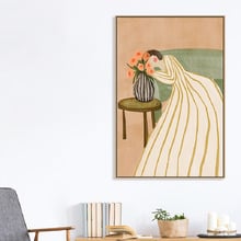 Woman Admiring Flowers Canvas Wall Art