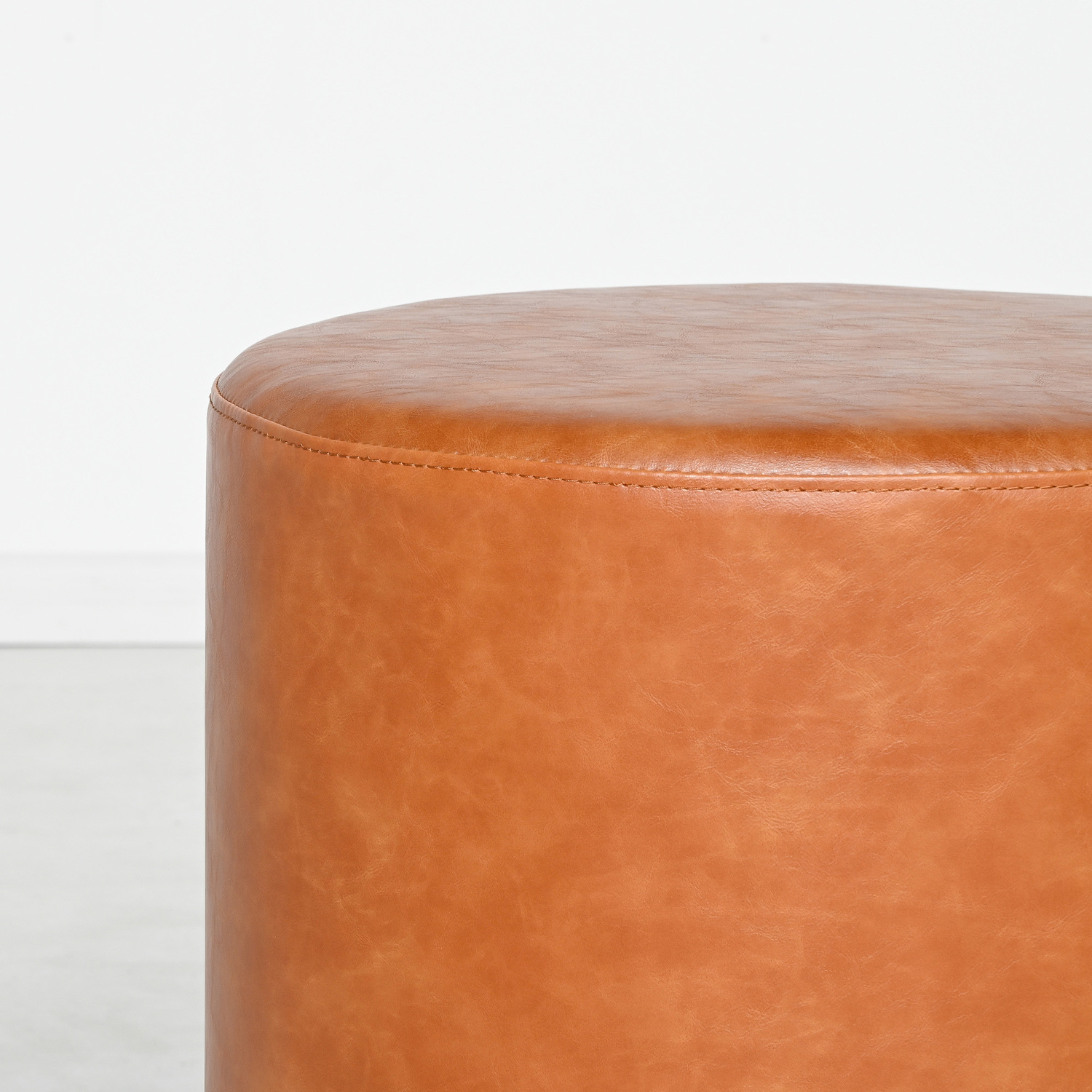 Small-Round-Aryal-Faux-Leather-Ottoman