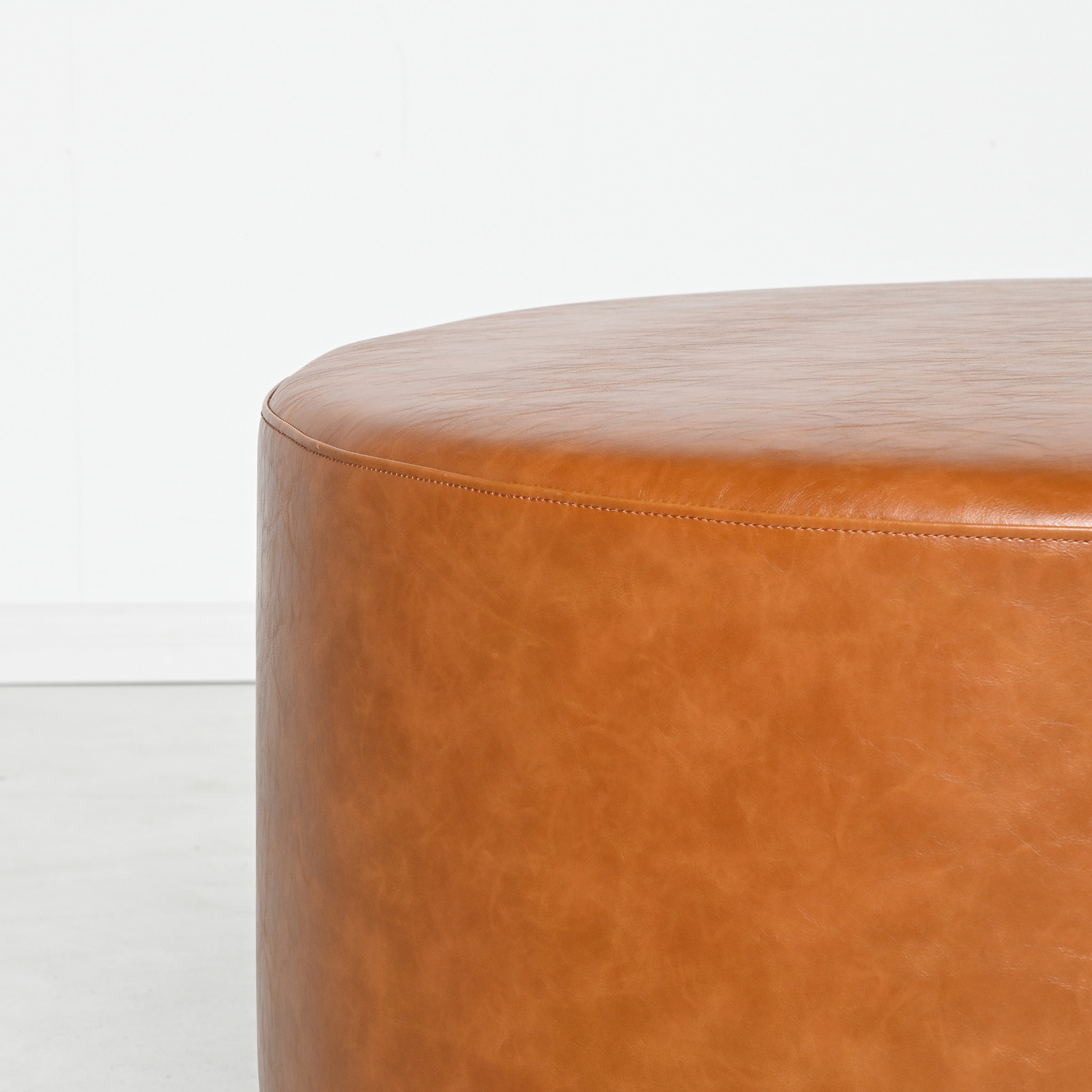 Medium-Round-Aryal-Faux-Leather-Ottoman