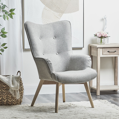 grey upholstered armchair