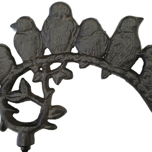 Dark Brown Birds Perched Over Iron Bell