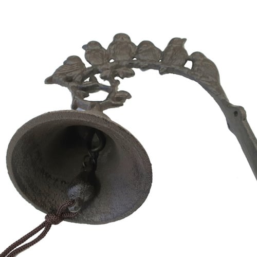 Dark Brown Birds Perched Over Iron Bell