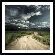 Road into Stormy Clouds Framed Print