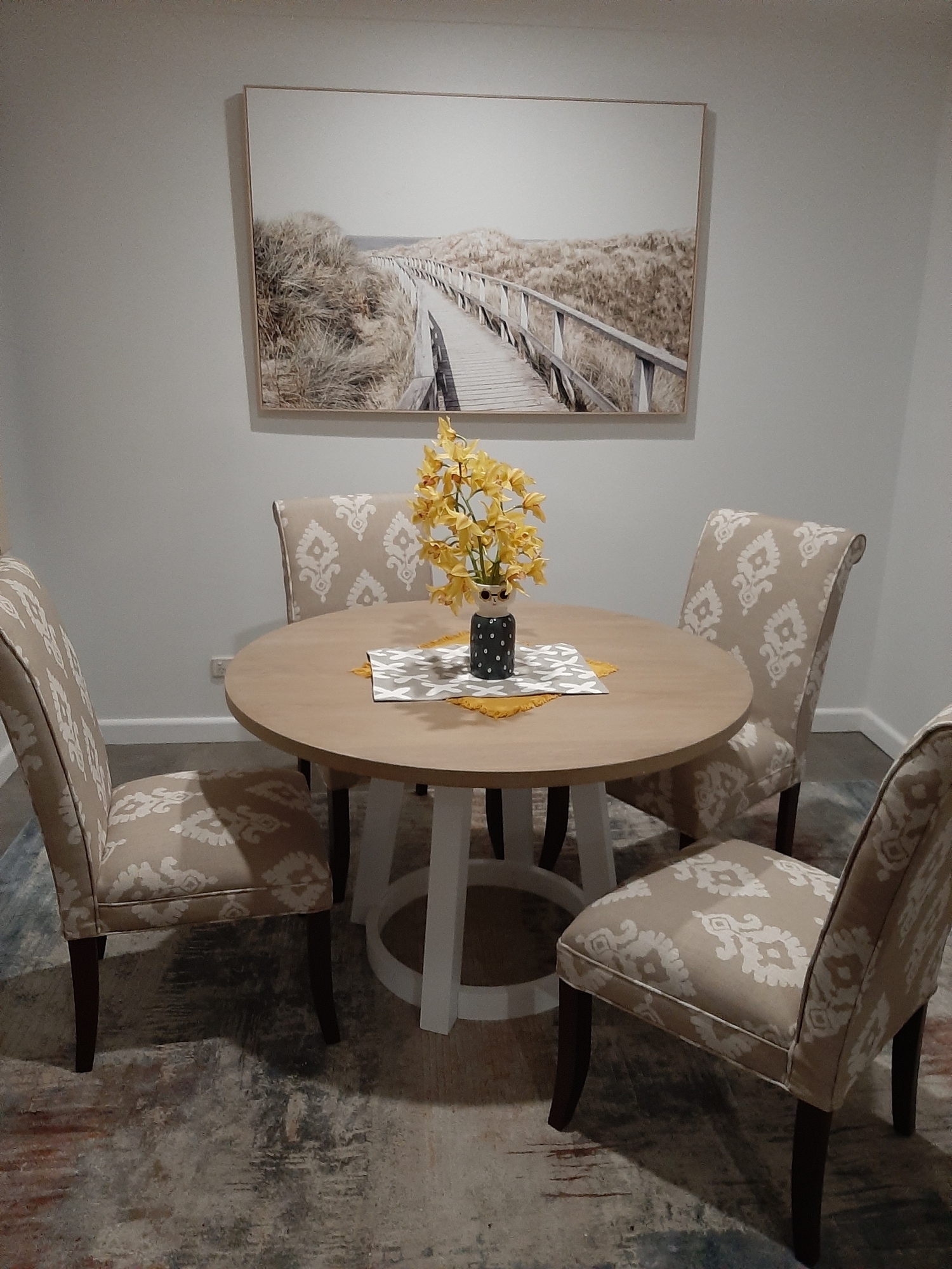 cream colored round dining table