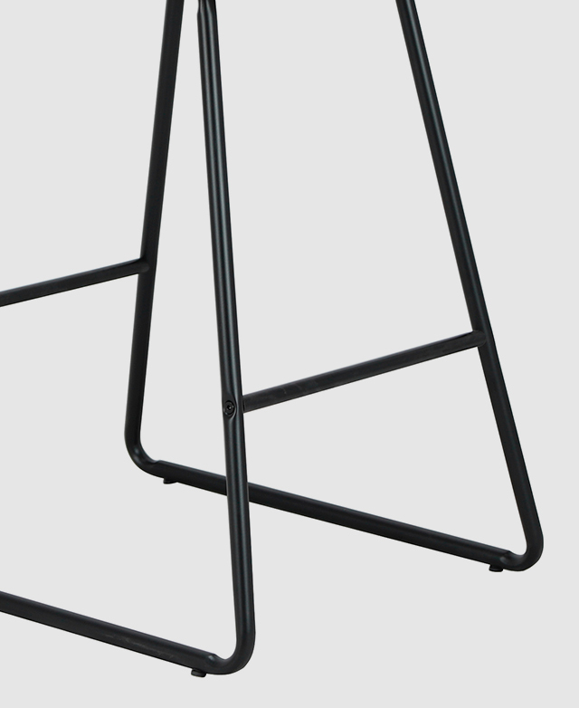 Base of the counter stool is shown. A footrest is at the front and back, and floor protectors are underneath each leg.