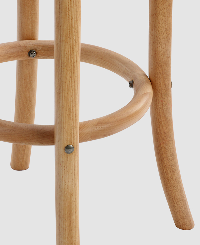 Four legs of a barstool are connected by an interior support ring that doubles as a footrest. Four legs of a barstool are connected by an interior support ring that doubles as a footrest.