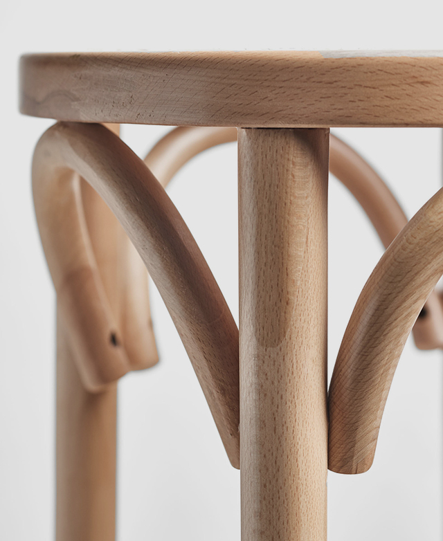 Zooming in on the top of the barstool shows the arching bentwood detail of the beech wood frame. Zooming in on the top of the barstool shows the arching bentwood detail of the beech wood frame.