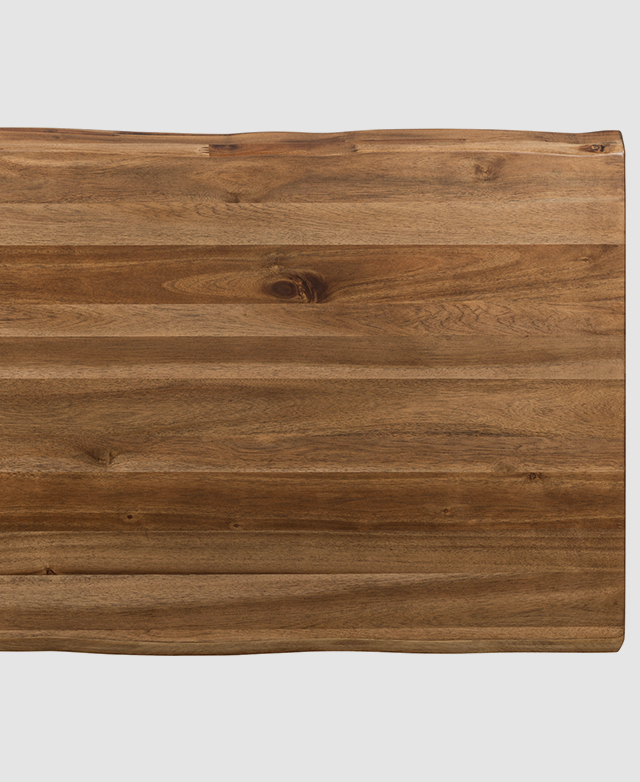 Bird's-eye view of the natural, live edges of the wood along the length of the table top.