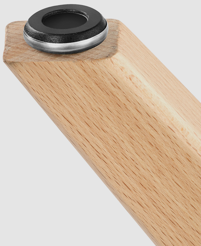 An extreme close-up of the beech wood leg and the attachment at the end that allows you to adjust the height.