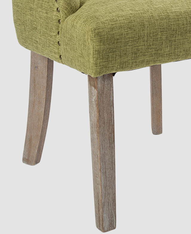 The distressed texture of the solid oak wood legs is shown, enhancing the antique look of the chair. The distressed texture of the solid oak wood legs is shown, enhancing the antique look of the chair.