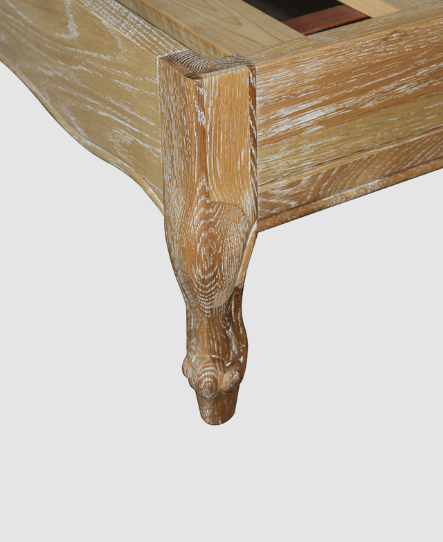 A close-up of a Queen Anne-style leg shows the oak wood's grains in detail.