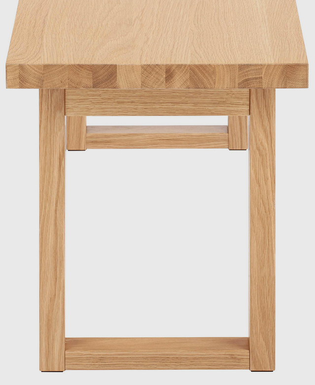 The sleigh-leg base underneath the bench top is viewed from front on, illustrating its rectangular shape.