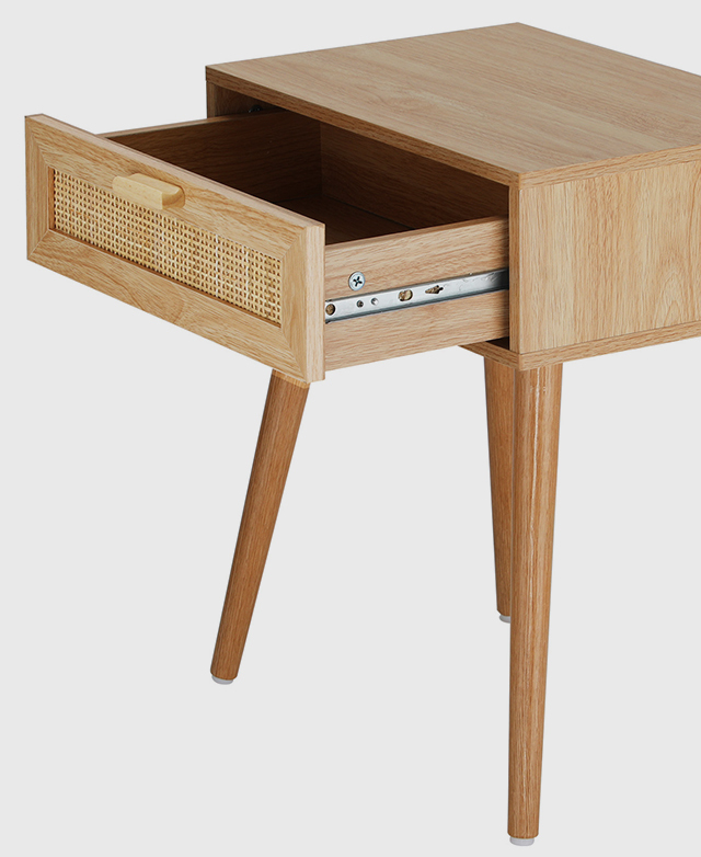 Angled view of a bedside table with the drawer pulled out slightly, revealing its metal runners.
