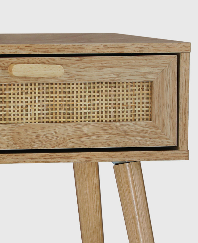 Close-up of the slender rectangular drawer with a rattan panel. A 3D oval-shaped handle protrudes out at the top.