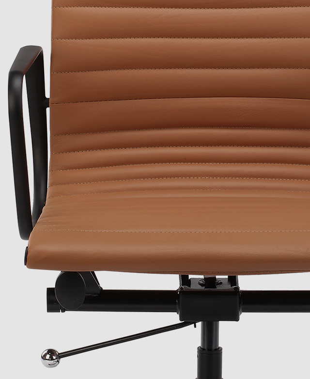 The tan iteration of the chair is shown front-on. The focus is on the panelled widths on the seat.