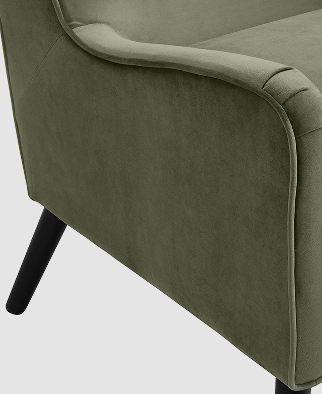 The foam-padded armrest of the chair is in focus; it gently curves upwards at the front. The foam-padded armrest of the chair is in focus; it gently curves upwards at the front.