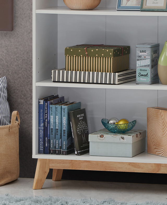 A range of household items are neatly stored in a white shelving unit with a solid rubberwood frame underneath.