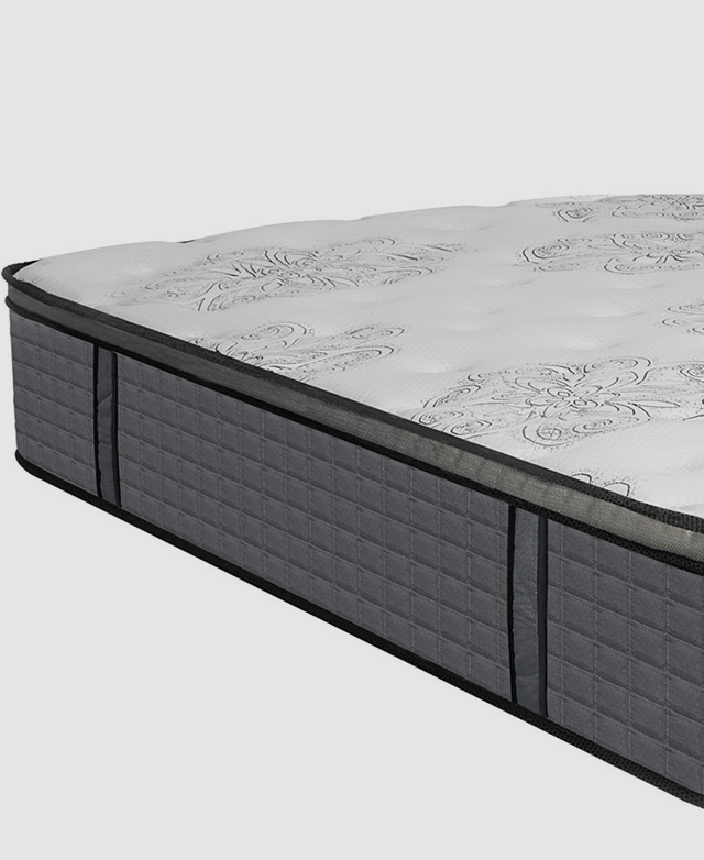 A side view of a premium pocket spring mattress with two handles stitched onto the design for easy carrying.