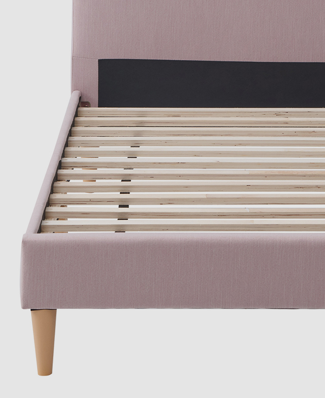 The interior base of the bed frame features wooden slats that are evenly spaced apart.