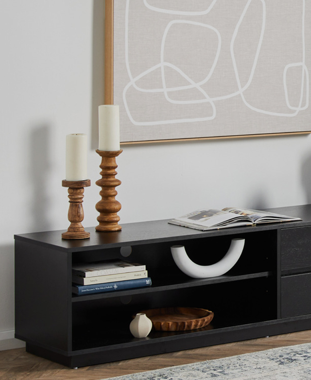 The open shelves at one end of the unit have multiple decor pieces arranged to a stylish effect.