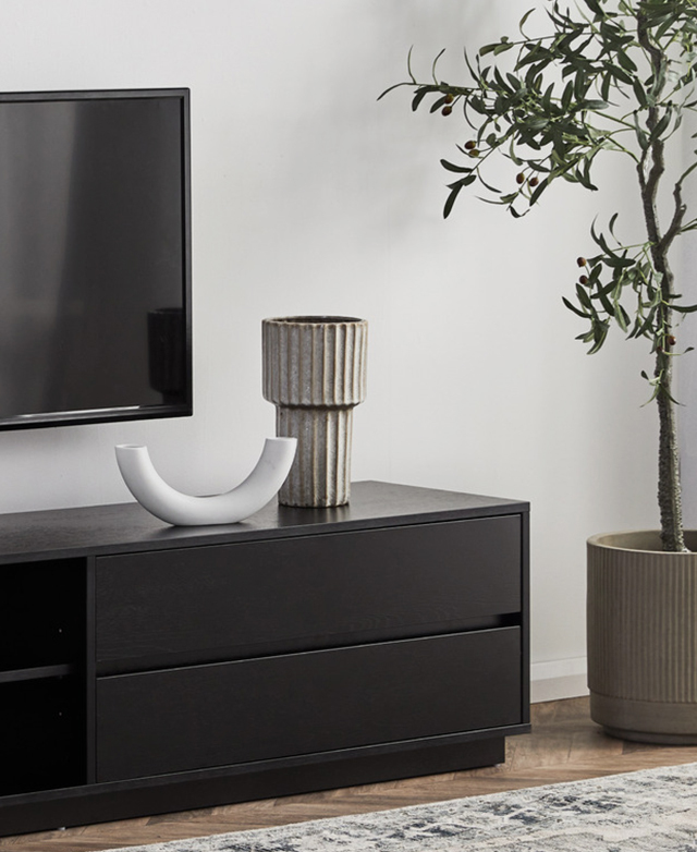 The drawer end of the black unit is shown, highlighting its neat, handle-free design.