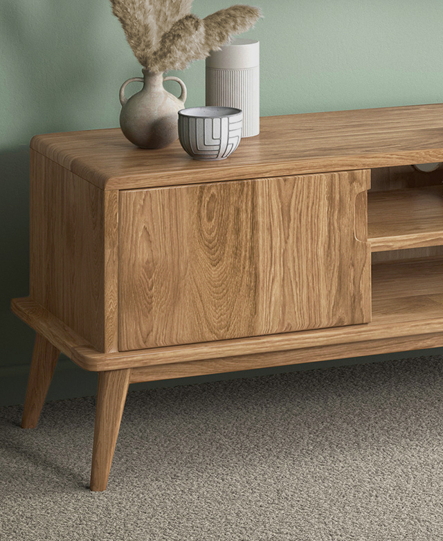 Three-quarter close-up view highlights the recessed handle of a cupboard, plus smoothly rounded edges and corners. Three-quarter close-up view highlights the recessed handle of a cupboard, plus smoothly rounded edges and corners.