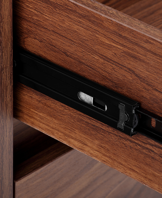 Close up of a black metal runner along the side of the drawer. Close up of a black metal runner along the side of the drawer.