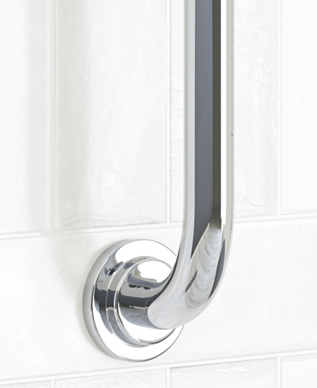 Bottom of the chrome gooseneck shower arm against a white tile wall