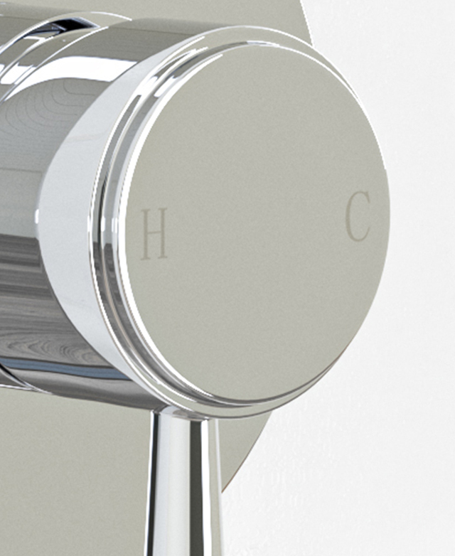 Traditional style shower wall mixer mounted on white tiles showing the hot & cold indicators