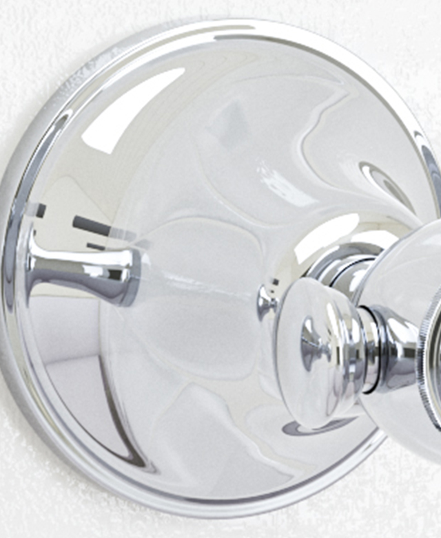 Traditional chrome lever wall tap assembly close up showing the spindles Traditional chrome lever wall tap assembly close up showing the spindles