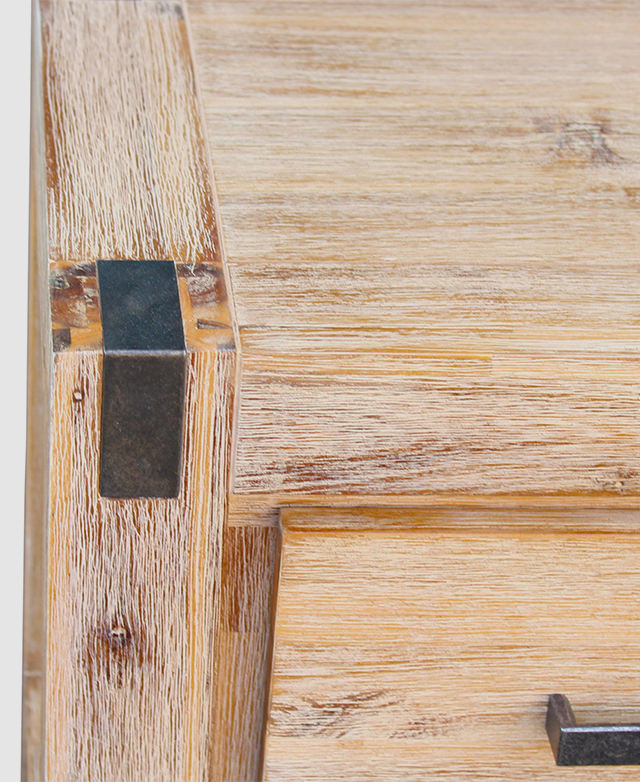 A cropped image shows one end, it's distressed finish, and metal joint detail