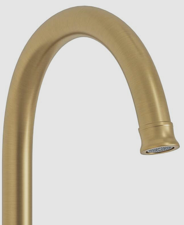 Close-up of the gooseneck and spout from the Stanwell brushed gold kitchen sink mixer agains a white background