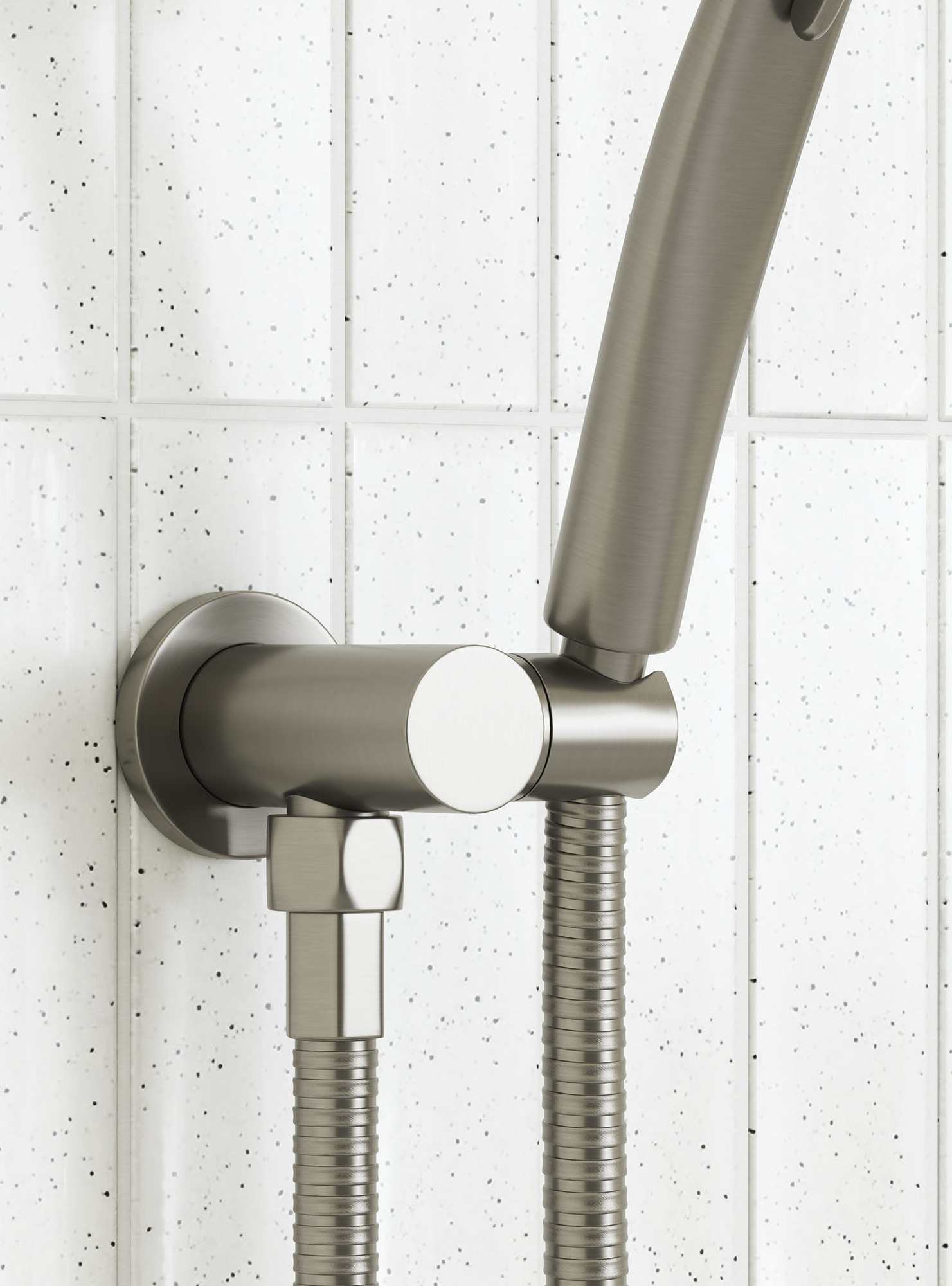 wall mounted brushed nickel shower hand piece bracket close up showing the PVD finish with a white tile background