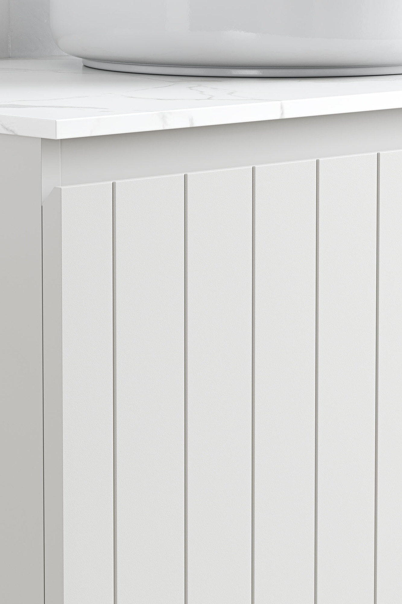 The bevelled top of the drawer is in focus, along with the smart vertical lines of the panelled drawer front in soft grey. The bevelled top of the drawer is in focus, along with the smart vertical lines of the panelled drawer front in soft grey.