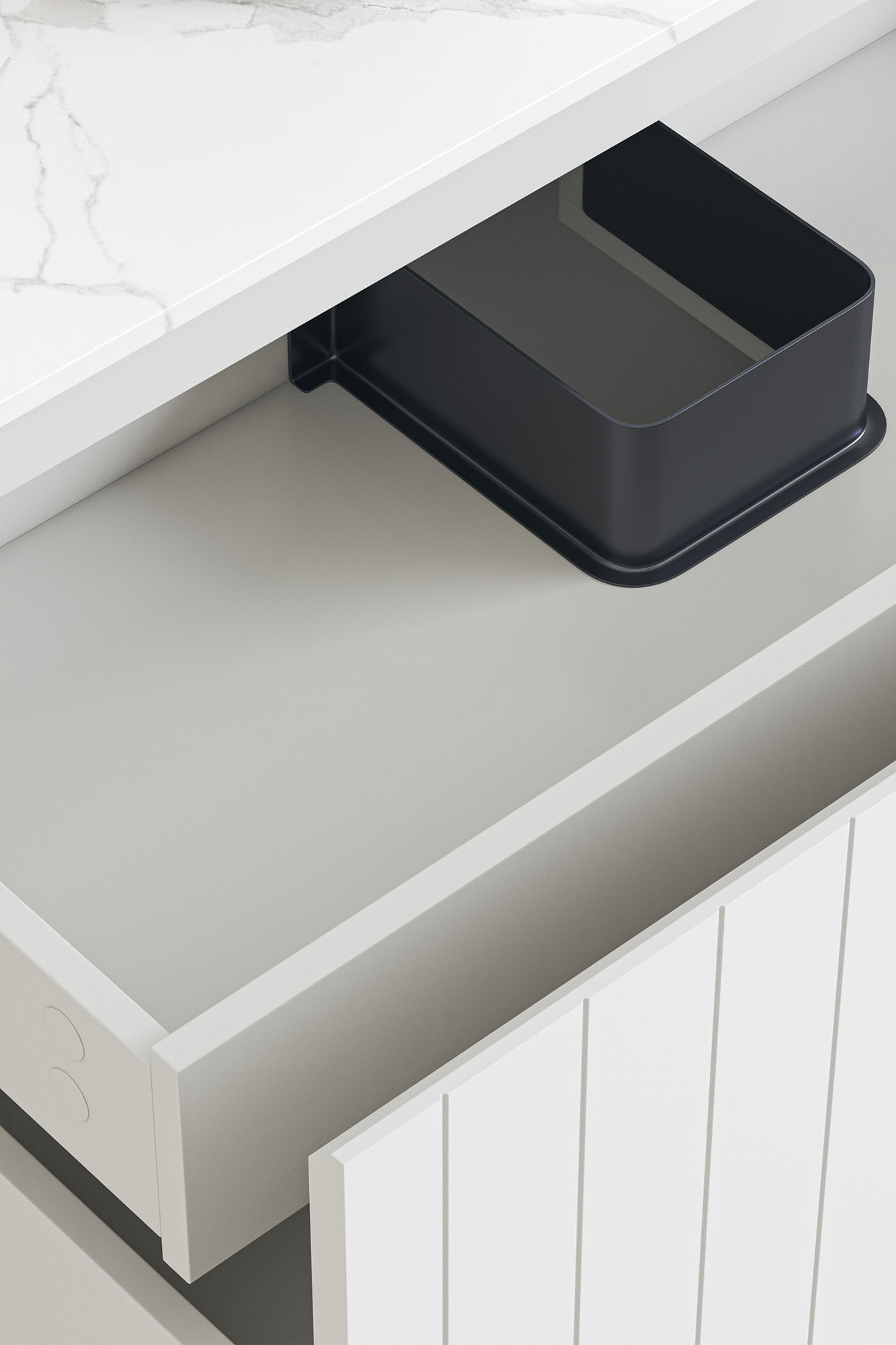 The drawers are shown open, with the focus on the shallow inner drawer. Grey veining of the white stone top is just shown. The drawers are shown open, with the focus on the shallow inner drawer. Grey veining of the white stone top is just shown.