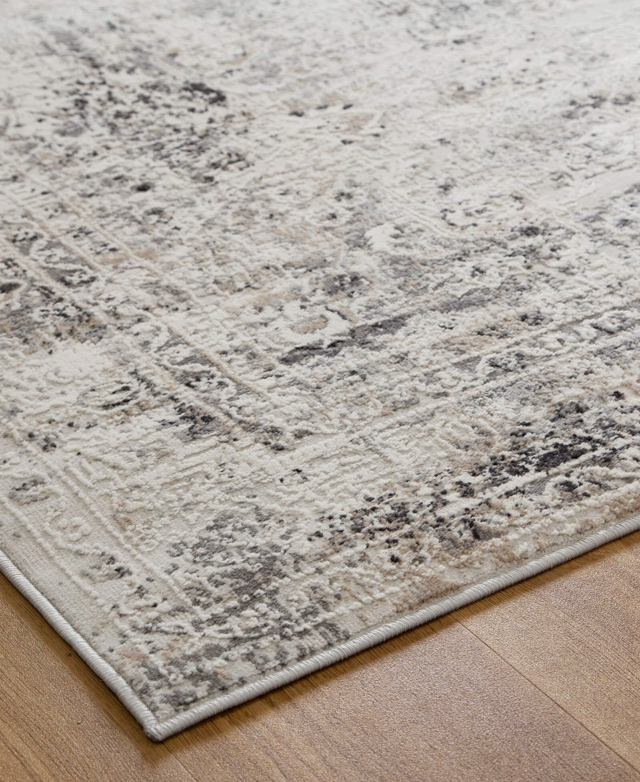 A corner view close-up of the rug highlights its tightly bound edges and low pile. A corner view close-up of the rug highlights its tightly bound edges and low pile.