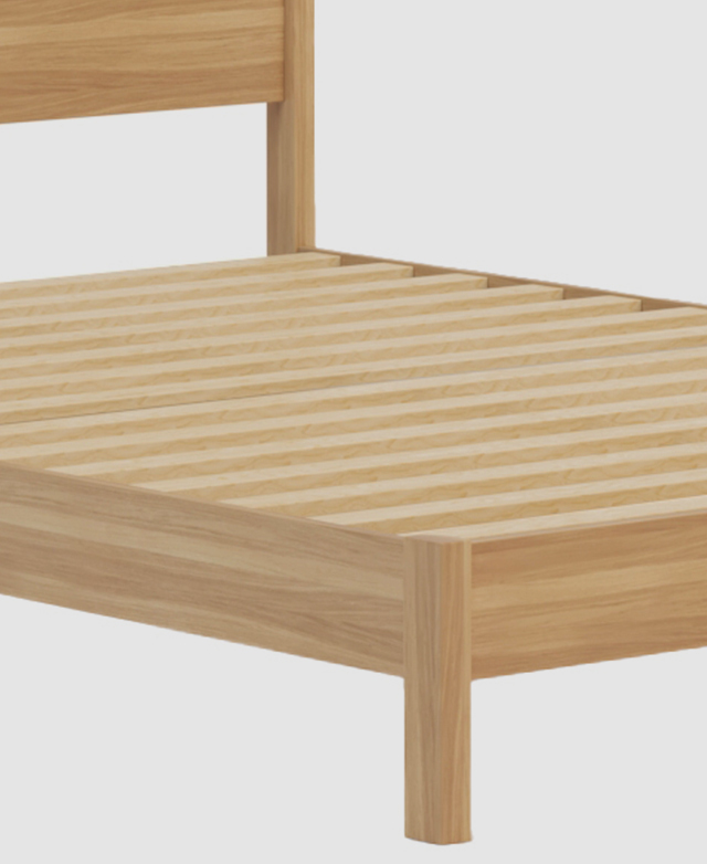 Three quarter angle of the fully assembled bed is shown without a matress to display the slatted mattress support.