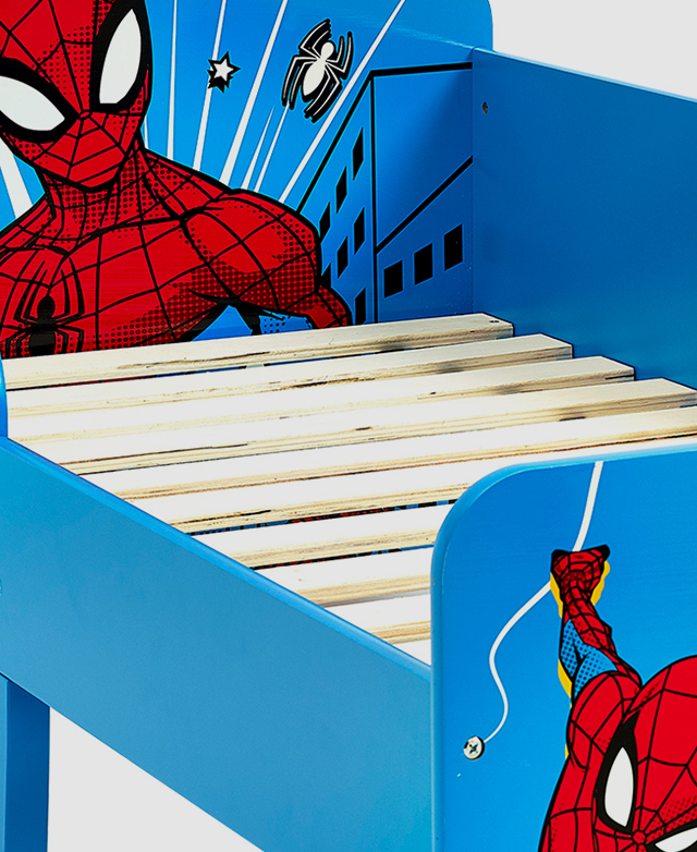 Three-quarter angle displays laminated veneer lumber slats within the bed's bright blue and red frame.