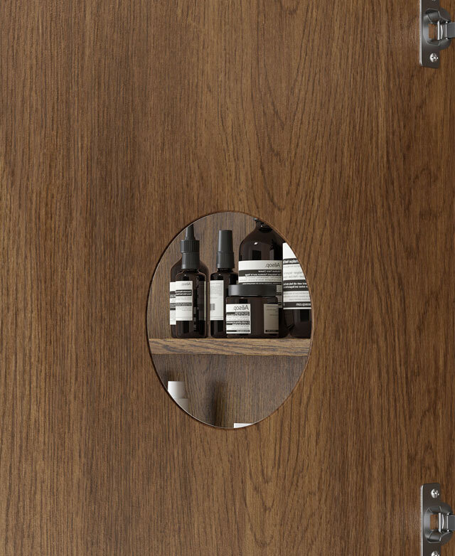 The inside of the shaving cabinet door shows a small, mounted, round 3-times magnification mirror.