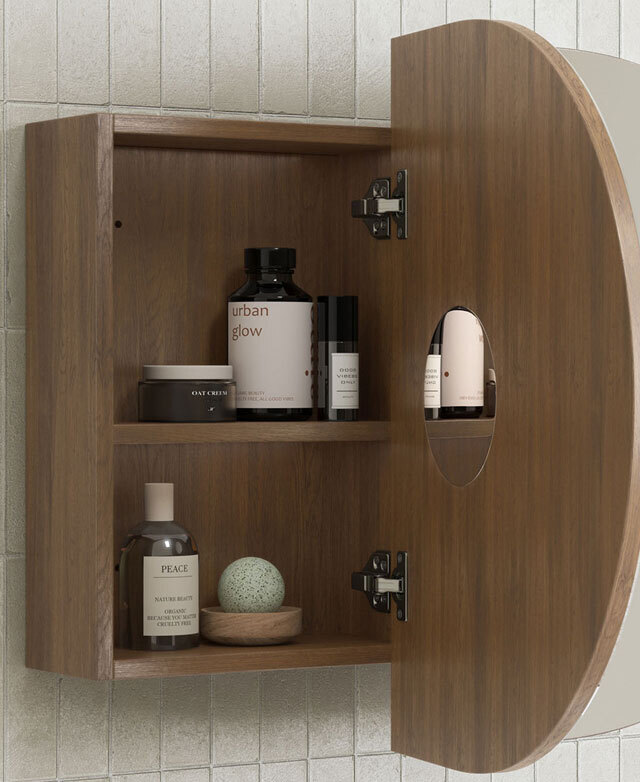 The inside of the shaving cabinet shows the warm timber shelving complete with bathroom products.