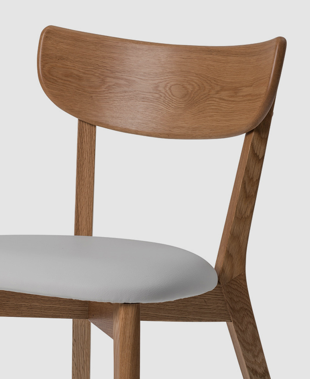 The top half of a chair is captured from front on, demonstrating its pared back yet functional design.