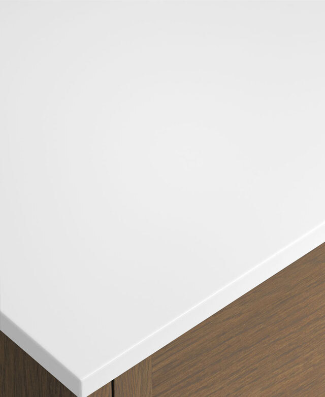 White top with rounded edge on light timber cabinet, showing clean, modern corner detail.