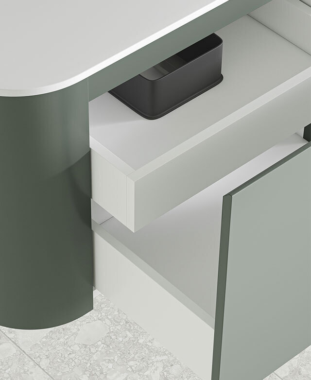 The main- and the internal drawers are open, with the neat bevelled edge of the green drawer in focus to highlight its fine finish.