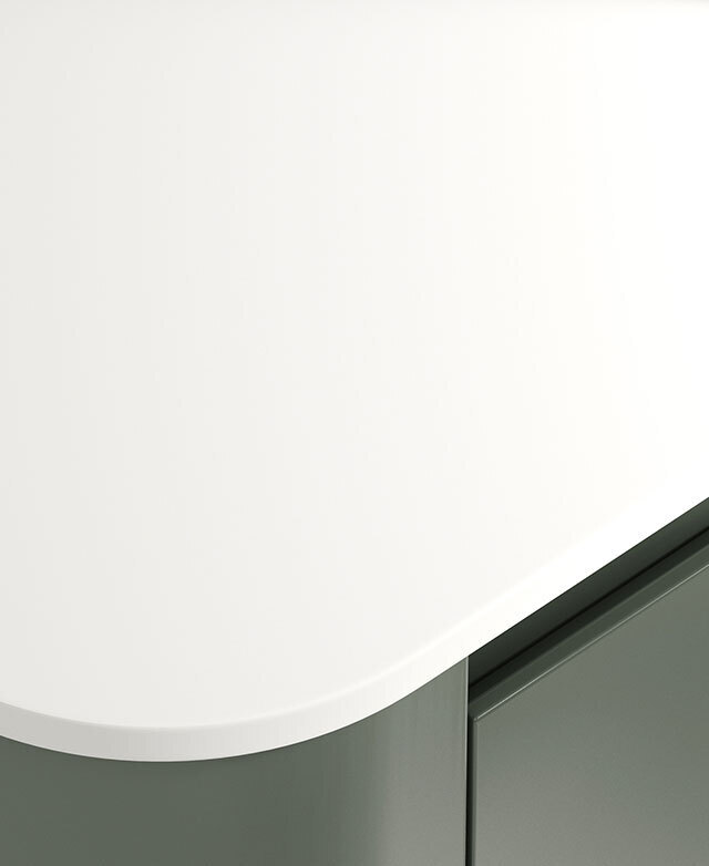 Highlighted is the crisp white sintered stone top and its rounded corner; the green base is just in the frame.