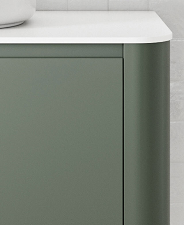 Front-facing cropped view of the green lacquered minimalistic bathroom vanity.