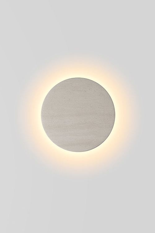 The 'Eclipse' wall light is hand made in Melbourne from SA limestone