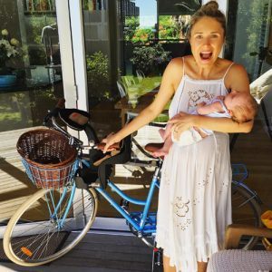 Magdalena last Christmas with her favourite gifts - a blue bike and beautiful baby Archie! Pic via Instagram @magdalena_roze