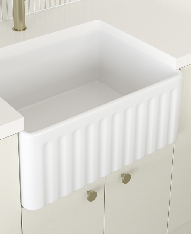 Fireclay sink positioned with the ribbed side front facing. Fireclay sink positioned with the ribbed side front facing.